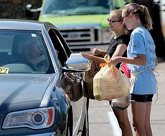 Serving it '50s Style:  Church youth raise $1300  during annual car hop