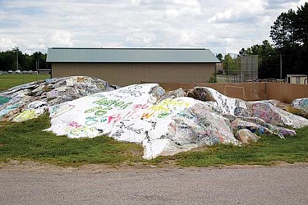 RHS Class of '86 paints over section  of 'the rock' during reunion weekend