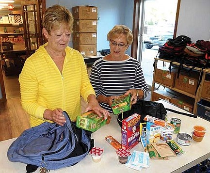 Marshfield Clinic and Security  Health Plan contribute to  Weekend Food for Kids program