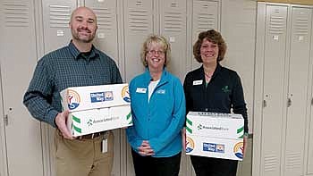 Associated Bank Rhinelander branch 'stocks the box' and donates school supplies to United Way