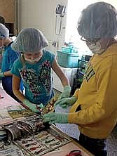 Crescent students perform text feature surgery