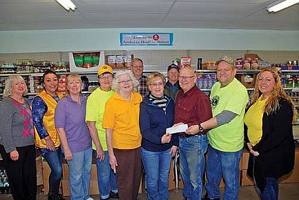 Lions club presents gift to food pantry