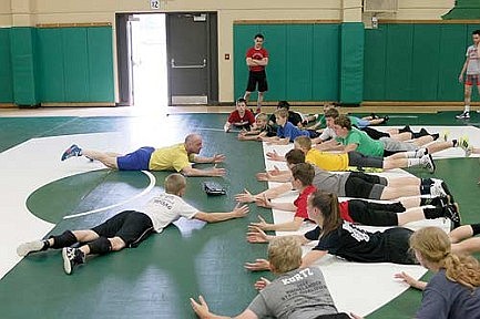 Hodag wrestlers bring in state champs to run camp