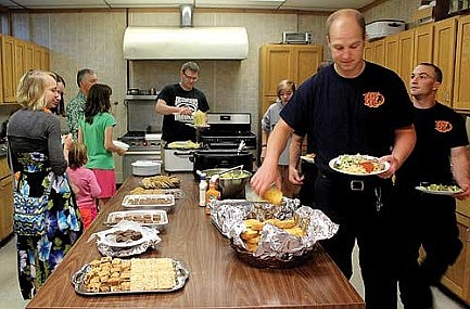 Immanuel, Trinity members prepare meal for firefighters