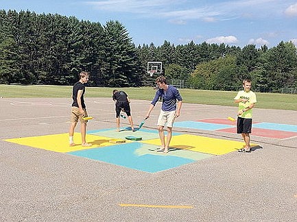 Soccer team helps with Peaceful Playground 