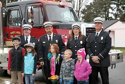 Three Lakes students ride fire truck to school