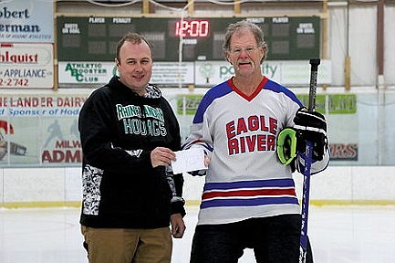 Photo: Noontime hockey gives back to RIA