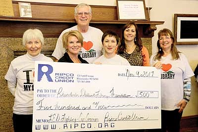 Ripco makes donation to library foundation for new lights