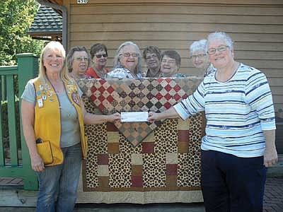 Rhinelander Lions donate to Northwoods Hospice Quilters