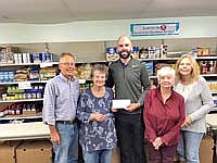 Edwards donates to food pantry