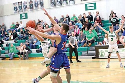 Merrill heats up late, races by Hodags 74-64