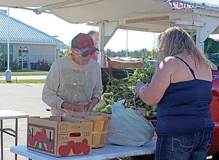 The man behind the corn stand