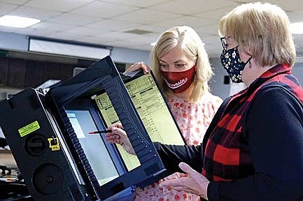 Volunteers step up to work the polls