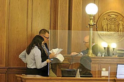 Defense requests competency examination of co-defendant in homicide case