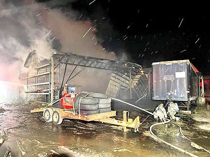 Fire destroys building at Pine Lake salvage business