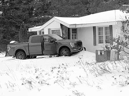 Truck strikes house
