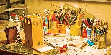 Fiorovante’s work station includes a diorama currently in the process of construction. 
(Photo by Jake Schexnaydre/Lakeland Times)
