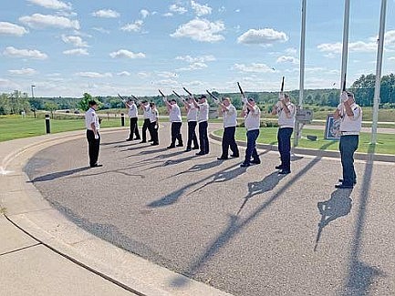 No greater honor:&#8200;Members of the  Northwoods Honor Guard salute the fallen